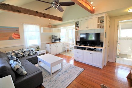 Wellfleet Cape Cod vacation rental - Family room with TV and kitchen in back left