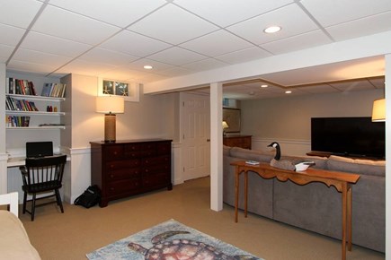 Harwich Cape Cod vacation rental - Basement entertainment space with desk