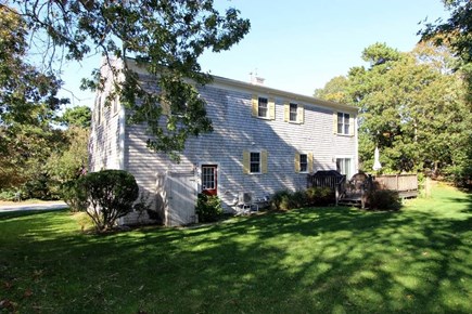 Harwich Cape Cod vacation rental - Back deck and large grass yard space