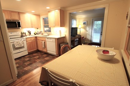 Centerville Cape Cod vacation rental - Dining/kitchen with added sleeper sofa room in the background