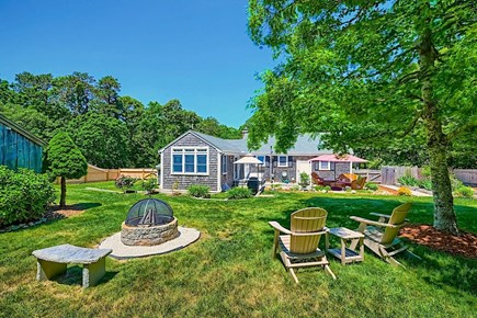 Brewster Cape Cod vacation rental - Looking from rear of this oversized lot.<br/>Big yard, nice grounds.