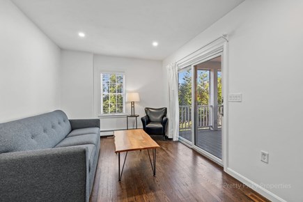 Dennis Cape Cod vacation rental - First level sitting room w/tv. Leads to screened in porch.