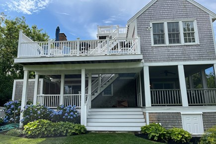 Dennis Cape Cod vacation rental - The back of the house features multiple levels of porches and decks.