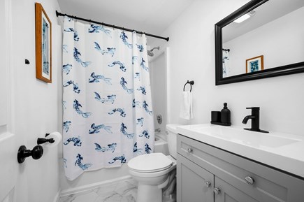 Mashpee Cape Cod vacation rental - First floor bathroom with shower/tub combo