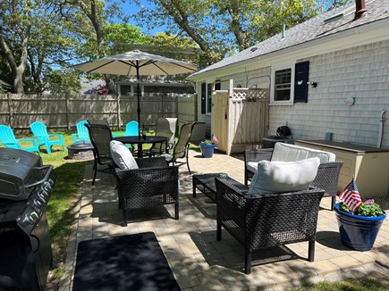 Falmouth, Maravista  Cape Cod vacation rental - Enjoy the spacious patio and backyard with peeks of Little Pond!