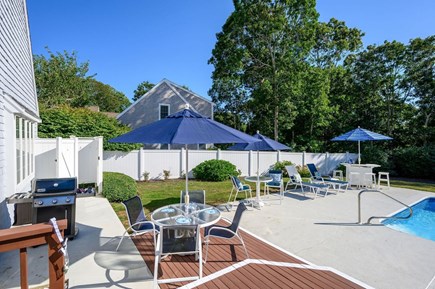 Harwich Port Cape Cod vacation rental - Outdoor seating and grill area  - pool is now fully fenced