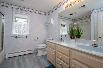 Harwich Port Cape Cod vacation rental - Full Bathroom #1 is en suite to Bedroom #1 with shower/tub