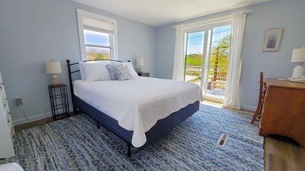 Wellfleet Cape Cod vacation rental - First floor bedroom with queen bed and slider to patio
