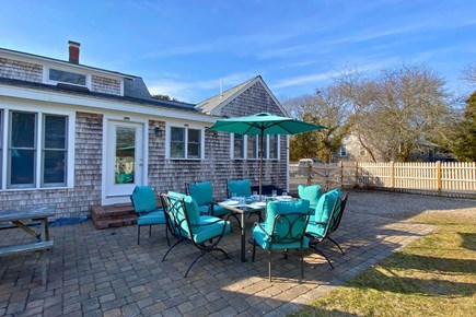 West Yarmouth Cape Cod vacation rental - Gather around the outdoors dining table for memorable meals .
