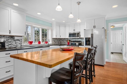 Harwich Port Cape Cod vacation rental - Have a seat for your morning coffee or a late night libation at this spacious island - 92 Hoyt Road Harwich Port Cape Cod - Apricari - NEVR