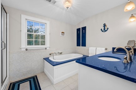Harwich Port Cape Cod vacation rental - Bathroom #3 is the Primary en suite full bathroom with double vanity, large tub and separate shower - 92 Hoyt Road Harwich Port Cape Cod - Apricari -