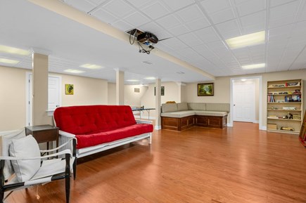 Harwich Port Cape Cod vacation rental - Large lower level family room provides plenty of seating and space for everyone to enjoy gathering together for movies projected on the large screen -