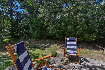 Chatham Cape Cod vacation rental - 4 Adirondack chairs and 2 stools for drinks between chairs.