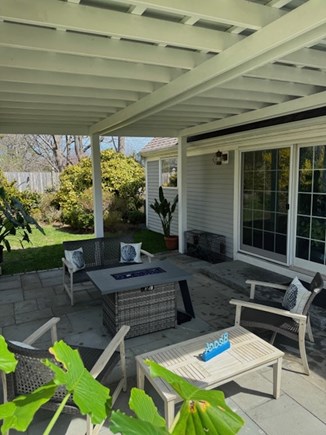 Brewster Cape Cod vacation rental - Patio comes with a snazzy fire table.