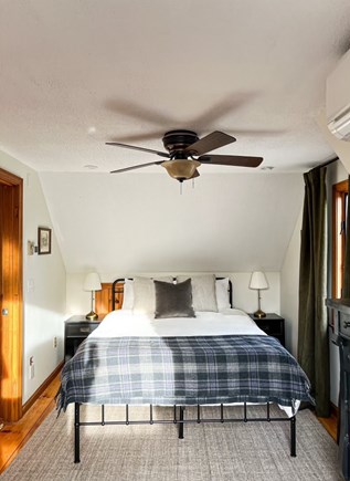 Provincetown Cape Cod vacation rental - Primary bed featuring queen bed, blackout curtains, and split AC
