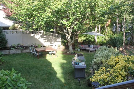 North Falmouth Cape Cod vacation rental - Backyard dining and lounging area