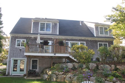 North Falmouth Cape Cod vacation rental - Deck, picnic table, French doors to basement