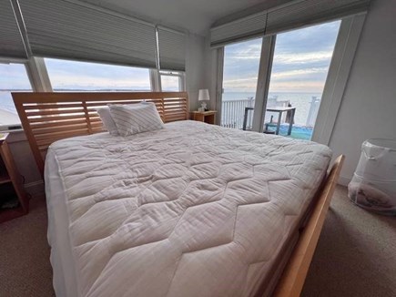Hyannis Cape Cod vacation rental - Primary bedroom with deck access and water view