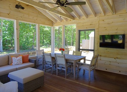 Eastham Cape Cod vacation rental - Gorgeous screened porch with sectional sofas, dining, and TV