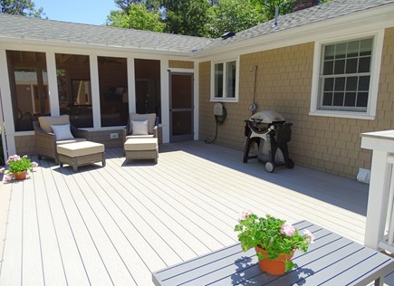 Eastham Cape Cod vacation rental - Private deck extends outdoor living space to paved patio and pool