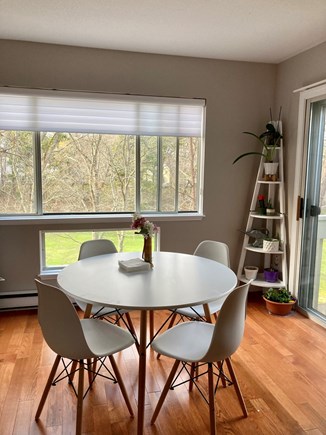 Brewster, Ocean Edge Golf Course Cape Cod vacation rental - Dining table in living space. Golf course views.