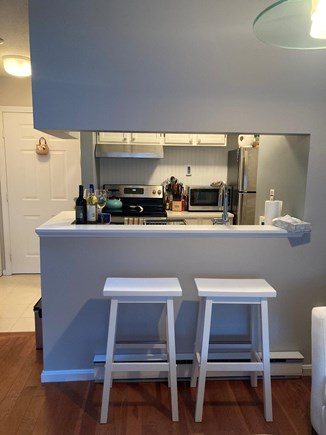 Brewster, Ocean Edge Golf Course Cape Cod vacation rental - Kitchen with everything: stove, oven, , Keurig, fridge, laundry.