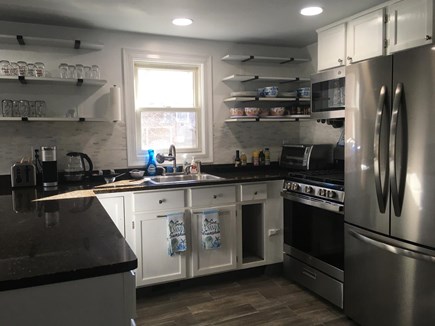 West Yarmouth Cape Cod vacation rental - Kitchen with new 5-burner gas stove & spacious ice-making fridge.