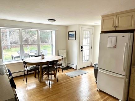 Osterville Cape Cod vacation rental - Fully-equipped eat-in kitchen opens up to large backyard.