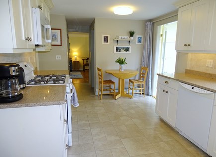 South Yarmouth Cape Cod vacation rental - Kitchen with small dining table, opens to porch
