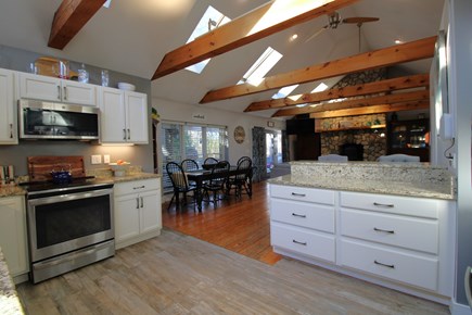 Brewster Cape Cod vacation rental - Kitchen to dining and family room with deck access