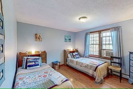 Barnstable, Hyannis Cape Cod vacation rental - A cute guest bedroom is furnished with two twin beds downstairs