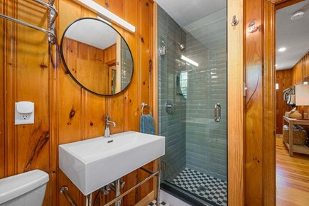 Dennis Port Cape Cod vacation rental - The stylishly renovated bathroom vanity next to the shower stall with glass door