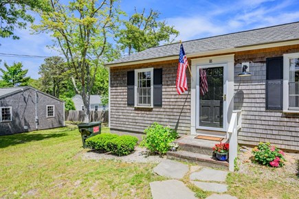 Dennis Port Cape Cod vacation rental - Salt Cottage Exterior with greenery and bright flowers