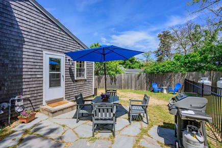 Dennis Port Cape Cod vacation rental - Back patio with dining and umbrella