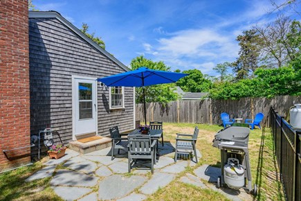 Dennis Port Cape Cod vacation rental - Back patio offers a gas grill and dining table