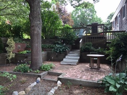 Truro Cape Cod vacation rental - Lower back porch area - fountain & additional relaxation area