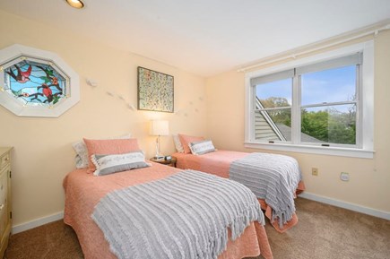 Orleans Cape Cod vacation rental - Upstairs sun dappled twin bedroom with large closet and shelving