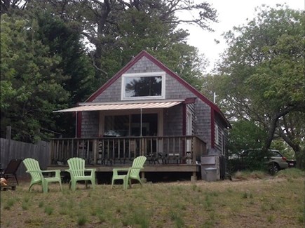 Wellfleet Cape Cod vacation rental - Front view in early spring. Relax on the deck & adirondack chairs