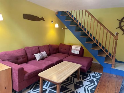 Wellfleet Cape Cod vacation rental - Living room with stairs to the upstairs master bedroom