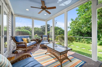 Eastham Cape Cod vacation rental - An screened in porch offers more space to relax in the shade.