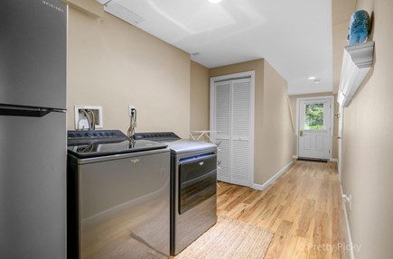 Eastham Cape Cod vacation rental - Washer/Dryer and extra fridge located lower level walkout.