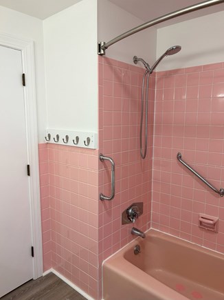 Yarmouth Cape Cod vacation rental - Hallway bathroom has a shower/tub combo with vanity and toilet.