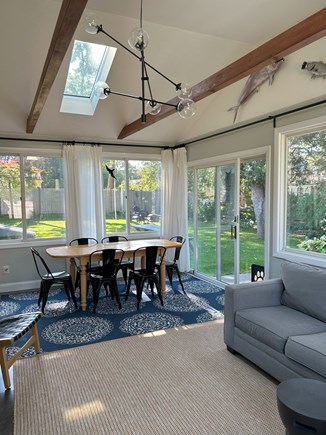 Yarmouth Cape Cod vacation rental - Sunroom has a dining table for 6, large sofa, TV w/ Roku, a/c.