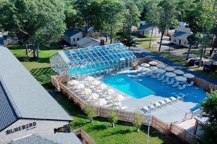 Dennis Port Cape Cod vacation rental - Aerial view of the Bluebird pool with Manning Road cottages beyond. Guests staying in the cottages can purchase a daily downloadable family pass