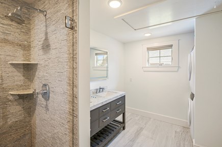 Harwich Port Cape Cod vacation rental - En suite bathroom with shower stall and washer/dryer