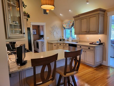 New Seabury Cape Cod vacation rental - Breakfast bar, fully equipped kitchen and laundry room beyond