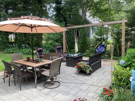 Mashpee Cape Cod vacation rental - Stone patio with gas fire pit, hammock stand with ring hook toss
