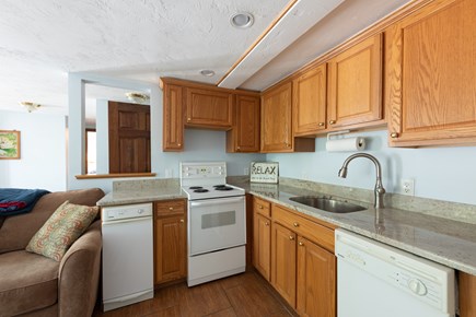 South Plymouth MA vacation rental - Ground level kitchen, sleeper sofa with added memory foam, TV