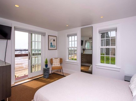 Provincetown Cape Cod vacation rental - Master bedroom. King bed. Balcony overlooking the harbor.