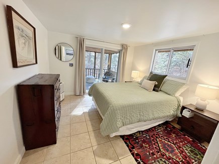 Wellfleet Cape Cod vacation rental - Primary bed with new queen mattress and sliding doors to porch